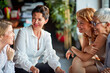 © luckybusiness - Group of cheerful business women chat during a break at workplace. Business, office, job