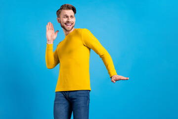 Sticker - Photo portrait of man dancing overjoyed looking blank space smiling isolated on bright blue color background