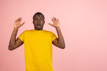 I'm afraid. Fright. Portrait of the scared man standing isolated on trendy studio background.