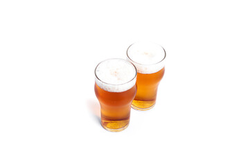 A glasses of light beer isolated on a white background. Light beer.