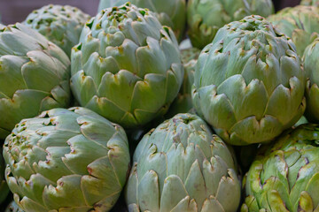 Macro photo of group of green artichokes. Fresh vegetables.