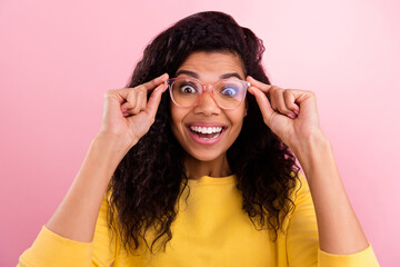 Poster - Photo of young excited african girl happy positive smile hands touch glasses isolated over pastel color background