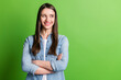 © deagreez - Portrait of attractive cheerful girl folded arms looking aside copy space isolated over bright green color background