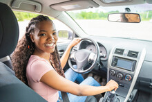 Young Black Teenage Driver Seated In Her New Car