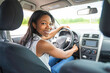 © Louis-Photo - black woman driver seated in her new car