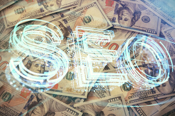 Double exposure of seo drawing over us dollars bill background. Concept of search optimization.