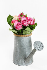 Wall Mural - Bouquet of pink garden roses in silver watering can.