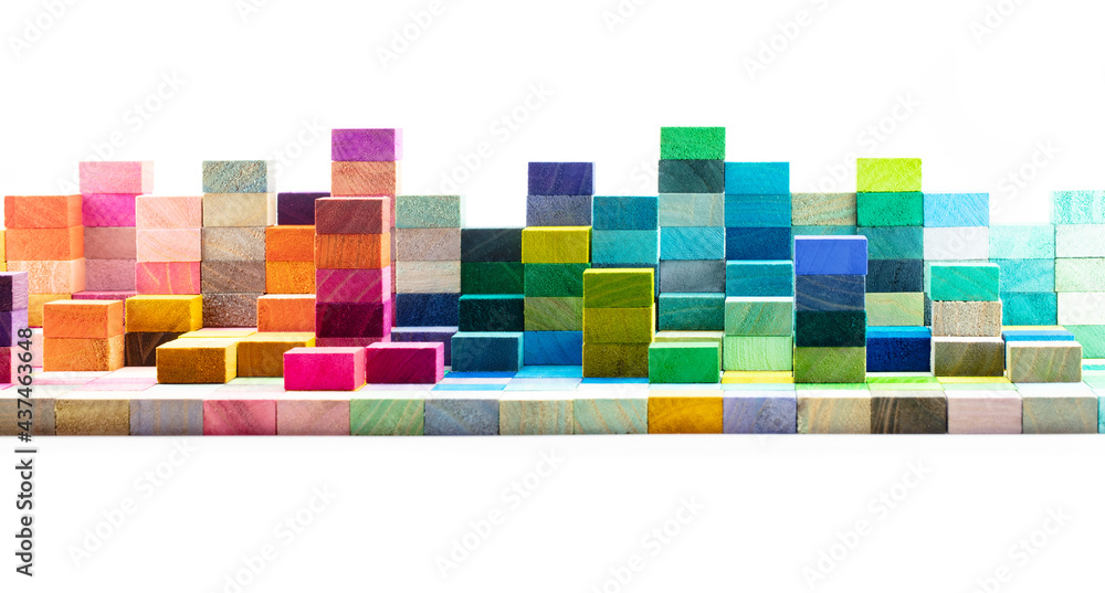 Spectrum of stacked multi-colored wooden blocks. Background or cover ...