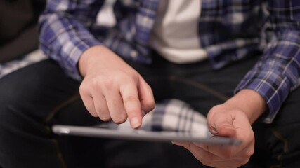 slow motion scen man hand press on digital tablet to turn on function technology for using home automation application to looking inside home and property for innovation future concept