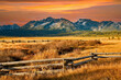 a split rail fence, pasture and meadow, and the Sawtooth Mountains near Stanley, Idaho.