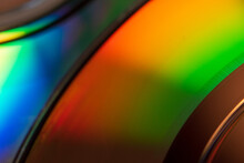 Abstract Photo Of The Reflection Of The Bottom Of A CD Displaying A Wide Array Of Colors On Its Shiny Film Surface. Photos Of Different Angles Producing The Different Color Schemes And Gradients.