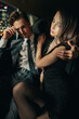 © Andrey Kiselev - glamorous pair in a car