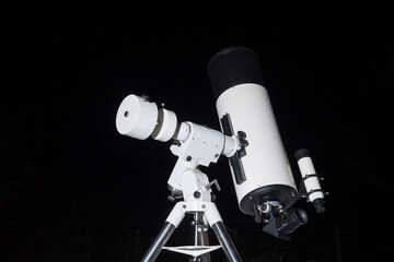 Wall Mural - photo of a telescope on a black background.