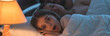 © realstock1 - The scared girl lay near the sleeping parents in the bed. night time