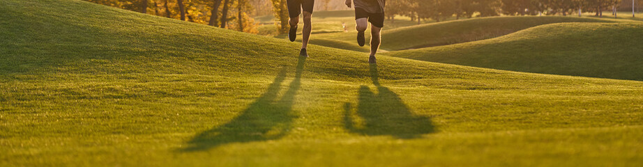 Sticker - The two men running in the beautiful park