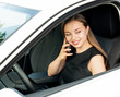 Modern beautiful woman businesswoman talking on the phone in her car.