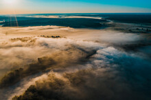 Aerial  View Of A Beautiful Summer  Landscape With A Fog While Dawn.  Photo From Drone Of A Foggy Landscape In Spring. Top View To Land While Sunrise. Early Morning In Nature, Misty  Weather.