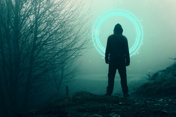 A spooky hooded figure, back to camera. Looking at a glowing, portal, gateway. In a forest on a foggy, winters day.