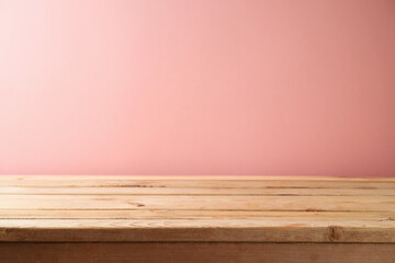 Wall Mural - Empty wooden table over pink wall background. Interior mock up for design and product display.