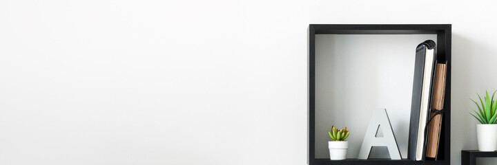 Sticker - Home office. A desk against a white wall. Copy space. Geometric composition. Square.