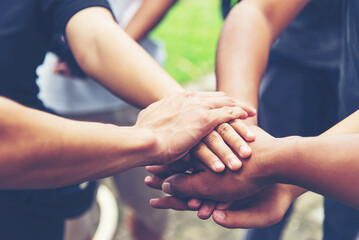 Wall Mural - Solidarity unite people hands together community teamwork. Hands of spirit team working together outdoor. Unity strong handshake with people or agreement of feeling or happy diverse education action