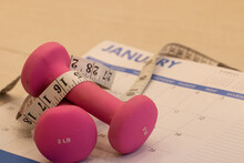 Healthy Lifestyle Concept, Pink Free Weights, Starting New Exersice, Measuring Tape. Motivation To Healthy Lifestyle.