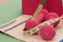 Healthy Lifestyle Concept, Pink Free Weights, Starting New Exersice, Measuring Tape. Motivation To Healthy Lifestyle.