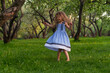 © yavdat - little girl runs barefoot on the grass. happy child on a hot summer day.