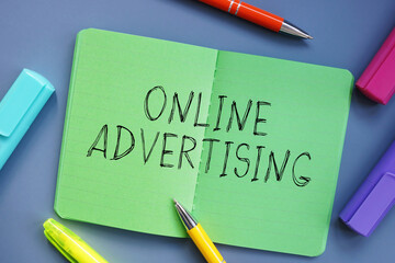 Business concept meaning Online Advertising with inscription on the sheet.