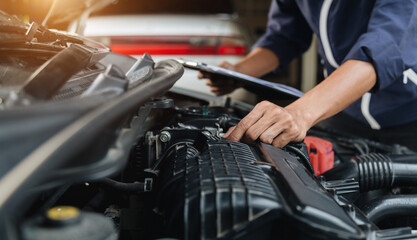 Automobile mechanic repairman hands repairing a car engine automotive workshop with a wrench, car service and maintenance,Repair service.