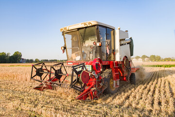 combine harvester working on a wheat field