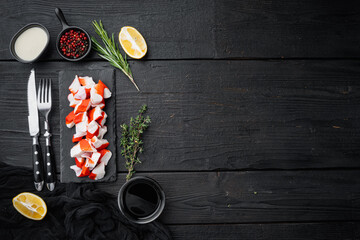 Wall Mural - Fresh Crab meat surimi with blue swimming crab, on black wooden table background, top view flat lay  , with copyspace  and space for text