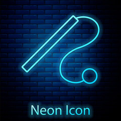 Wall Mural - Glowing neon Pet cat toy icon isolated on brick wall background. Vector