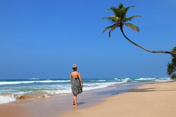 pretty girl on a dream beach with palm trees - Sri Lanka, Asia