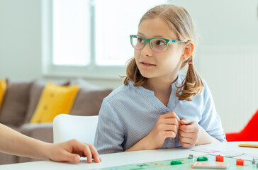 Wall Mural - Happy cute children playing board games and having fun at home