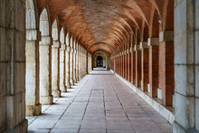 Large Symmetrical Exterior Corridor With Arches And Columns In The Old Royal Palace Of Aranjuez.