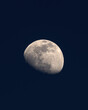 Vertical shot of waxing gibbous with dark sky in the background