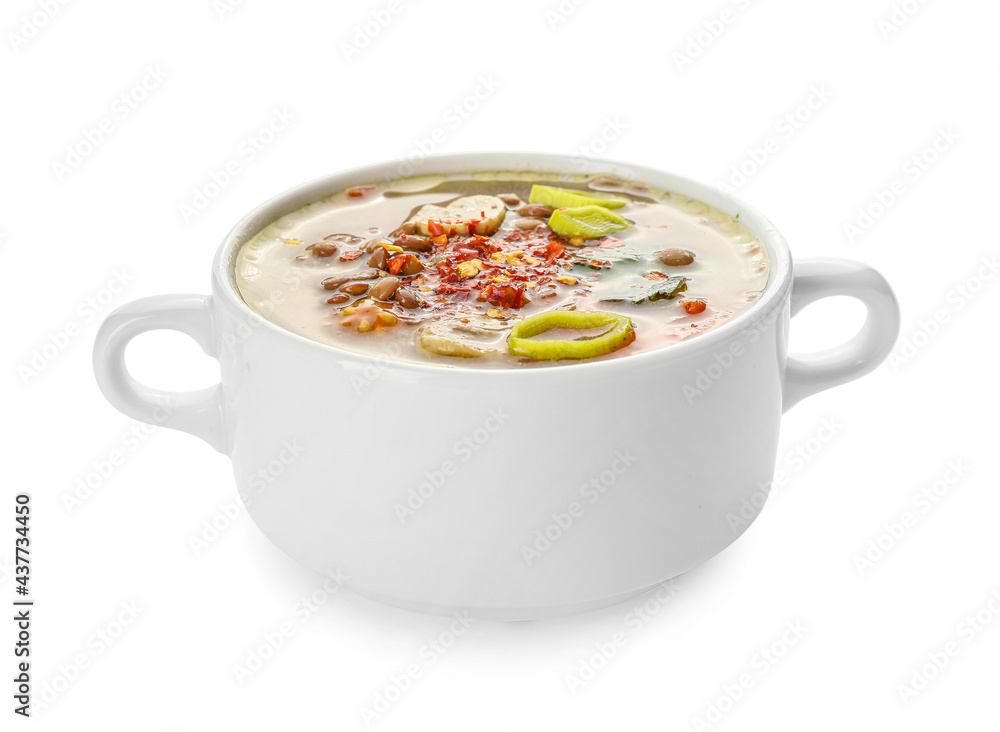 Pot of tasty lentil soup on white background