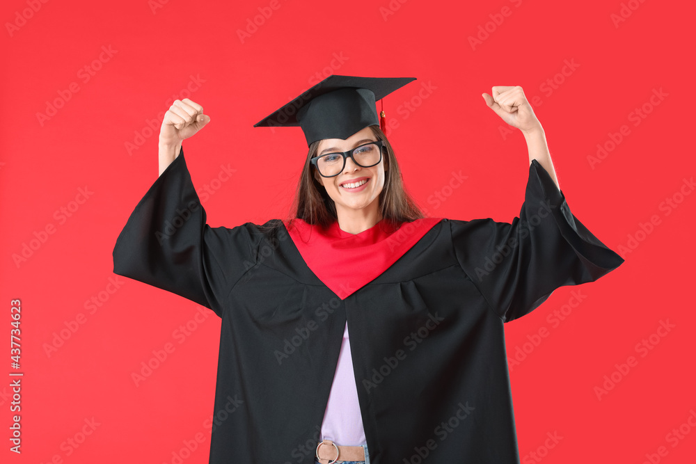 Happy female graduating student on color background