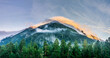 © VarnakovR - Panoramic landscape view, snow covered mountain peaks and colorful clouds over mountain range during sunset, Arkhyz villadge, Caucasus mountains, Russia