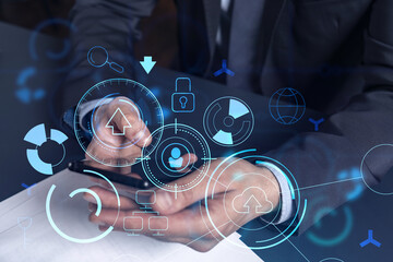 Programmer holding in the hands a smart phone and testing an innovative application to provide a completely new service. Close up shot. Hologram tech graphs. Concept of Dev team. Formal wear.