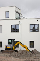 Building site of a new modern house with excavator