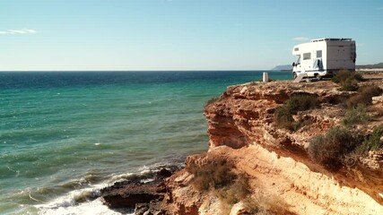 Canvas Print - Camper vehicle camping on seaside cliff. Mediterranean region of Mazarron, Sierra de las Moreras in Murcia Spain. Motor home holidays.