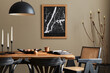 © FollowTheFlow - Stylish dining room interior with mock up poster map, wooden walnut table, design chairs, cup of coffee, decoration, tableware and elegant personal accessories in home decor. Template.