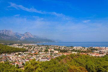 View of Kemer town on a coast of the Mediterranean sea in Antalya province, Turkey. Turkish Riviera. View from a mountain