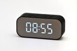 © moviephoto - Electronic clock with digital indication of time and date on a white background