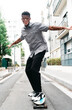 © PICHA - Young man having fun on a skateboard