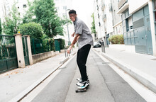 Young Man Skating In The Street