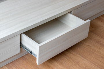 close up of Wood bed drawers in bedroom