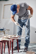 © astrosystem - Young adult man working on a DIY budget renovation of his new home apartment.